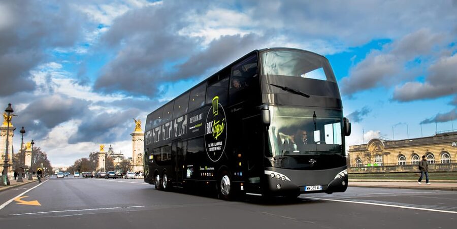 Bus Toqué Champs Elysées Tour w/ 3-Course Dinner & Champagne - Paris sightseeing with a table four meters above the street