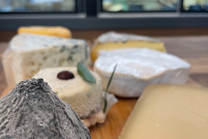 Cheese & Wine Tasting in Montmartre with a Local Cheesemonger - The stone-walled room is intimate, with a practical caveat