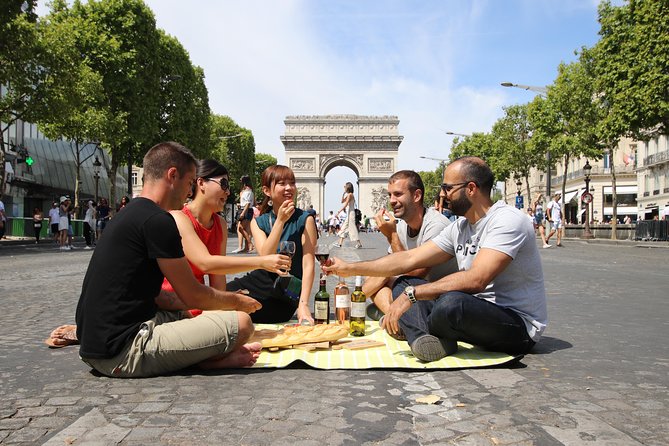First Day Bike Tour, Top Sights, hidden gems, Wine&Cheese picnic - Champs-Elysées, Grand Palais, and Pont Alexandre III