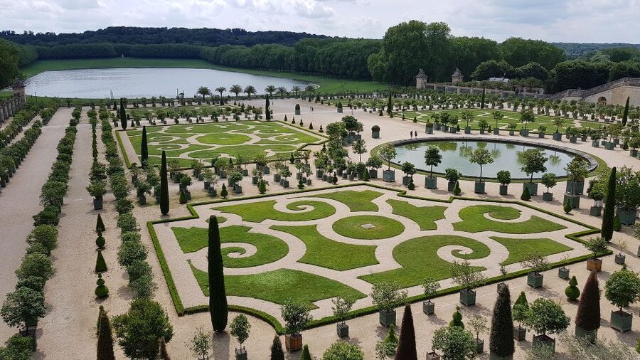 From Paris: Versailles Palace and Gardens Guided Experience - Entering the Palace of Versailles Gardens