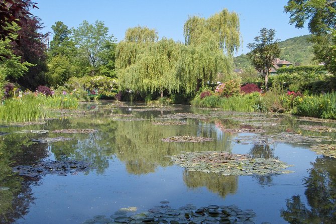 Giverny Half Day Guided Trip with Monet's House & Gardens from Paris by minivan - Leaving Paris near the Louvre