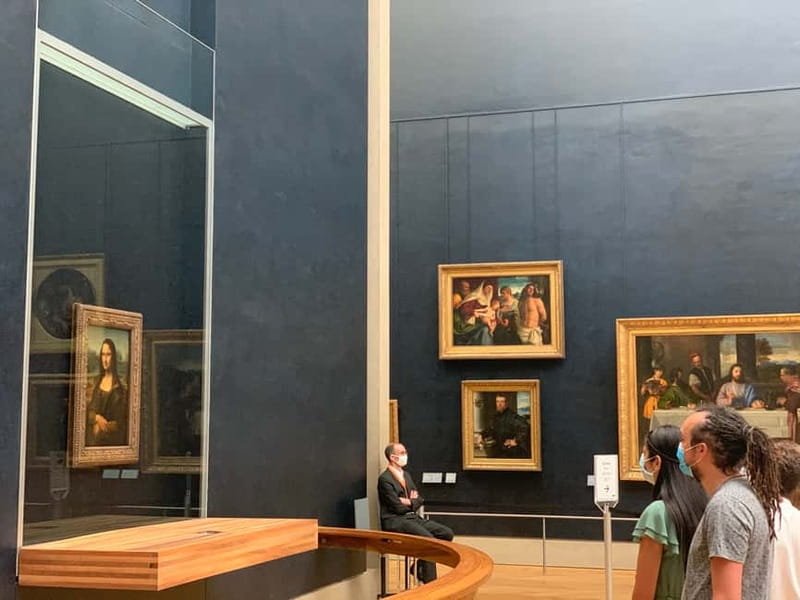Louvre Museum: Skip-the-Line Small Group Guided Tour - Passing the Louvre Pyramid before entering