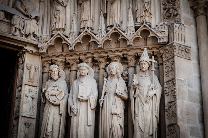 Medieval Paris: Notre Dame, Sainte Chapelle and Conciergerie - Notre-Dame begins with stone, fire, and restoration