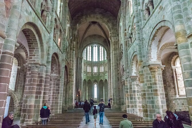 Mont Saint Michel Day Trip from Paris with English Speaking Guide - Exploring the abbey with the included ticket