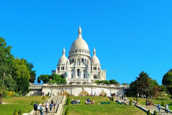 Montmartre Hill French Gourmet Food and Wine Tasting Walking Tour - Starting beside the Moulin Rouge