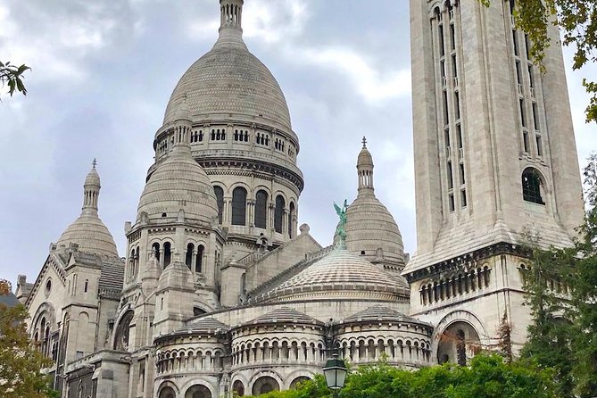 Montmartre Self-Guided Audio Tour: More Than Meets the Eye - The windmill behind Renoir’s famous scene