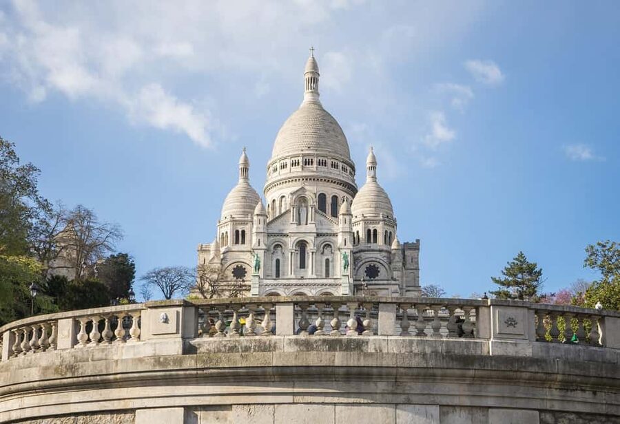 Montmartre Walking Tour in English - Why Montmartre feels unlike the rest of Paris