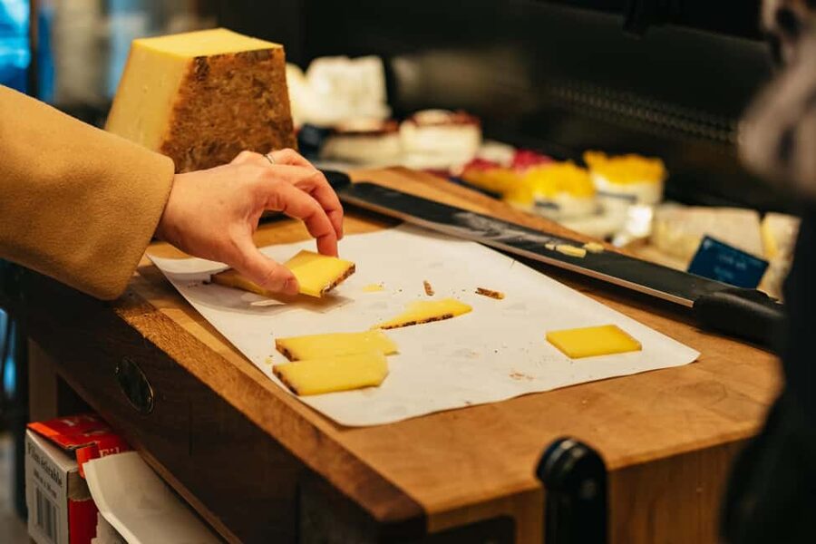 Paris: Gourmet Food Tour with Over 10 Tastings and Wine - A seated wine-bar course with cheese and charcuterie