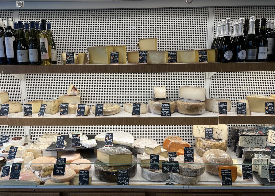 Paris: Guided Champagne & Food Tour in St-Germain-des-Pres - Five food stops, from cheese shops to Maison Mulot