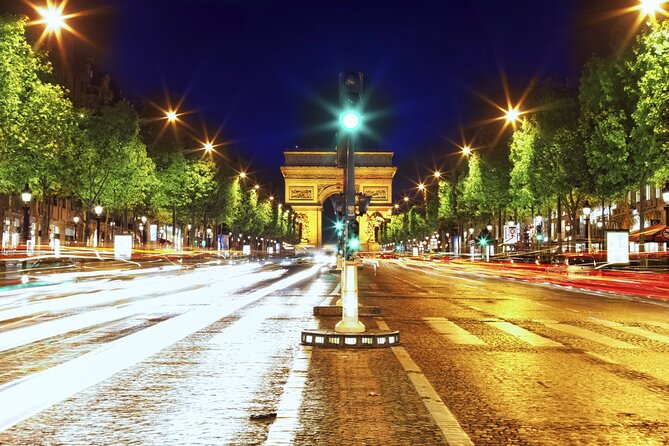 Paris Illuminations Tour with Moulin Rouge Show and Cruise Option - Meeting beneath the Eiffel Tower at Port de la Bourdonnais