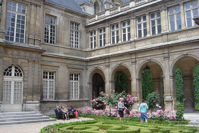 Paris Le Marais Historical Walking Tour with Wine and Cheese Tasting - Finding the medieval Wall of Philip II Augustus