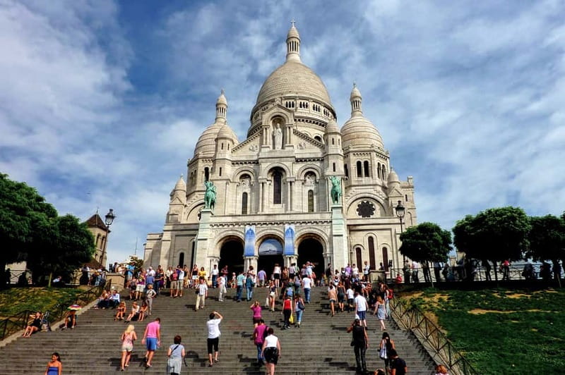 Paris: Montmartre Hidden Gems and Highlights Walking Tour - Climbing toward Sacré-Cœur