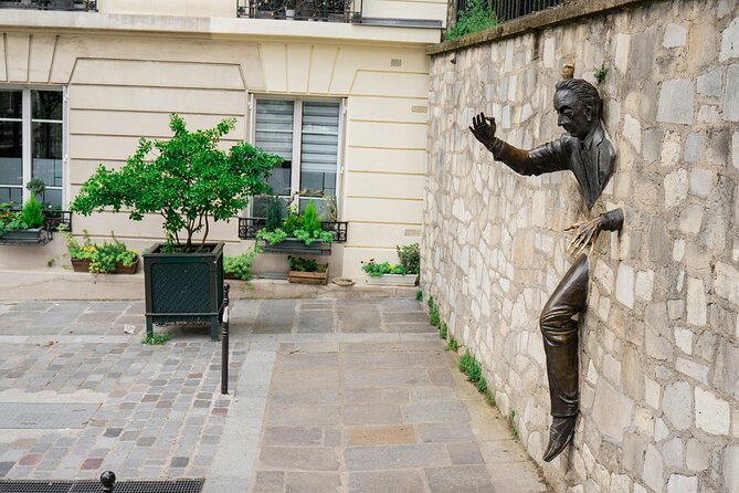 Paris - Montmartre Small Group Walking Tour with a True Local - The wall-passing man and Montmartre’s stranger side
