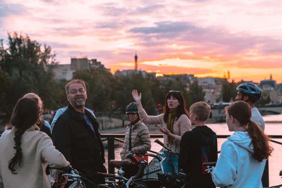 Paris: Night Small-Group Bike Tour and Boat Cruise - Invalides and the Champs-Élysées after dark