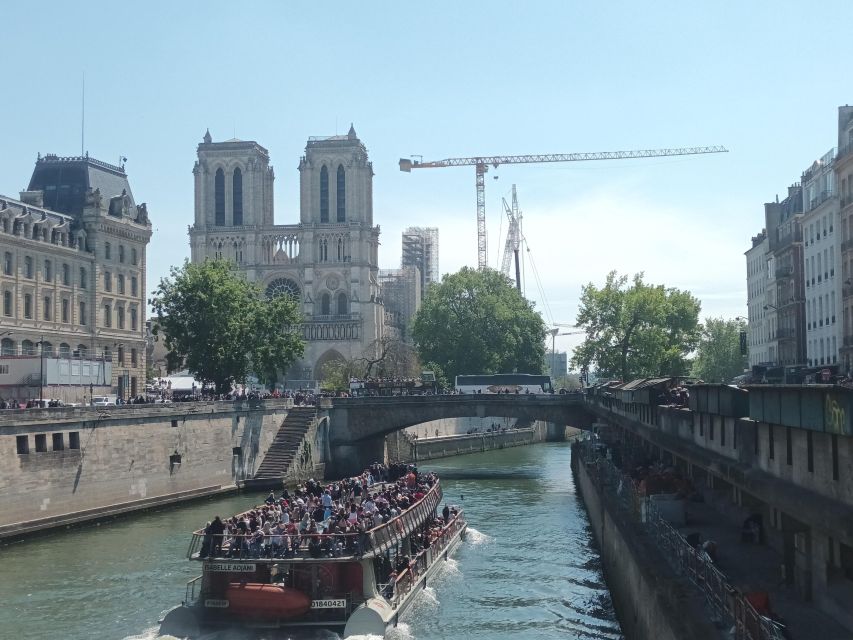 Paris: Notre Dame Exterior Walking Tour with Sainte Chapelle - Place Saint-Michel and the walk through Île de la Cité