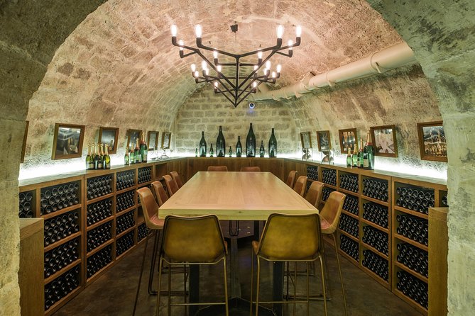 Paris - Ten Wines and Ten Cheeses Tasting in a Royal Cellar - Entering Les Caves du Louvre near the palace