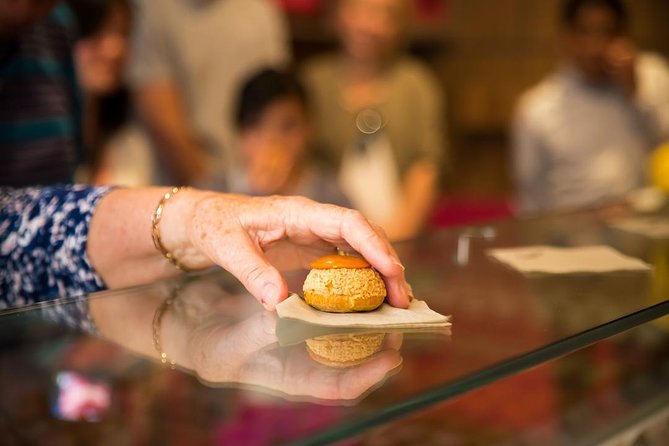 Saint-Germain Flavors Sweet & Savory Food Tasting Tour - Macarons, pastries, and colorful shop windows