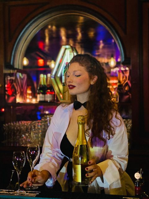 Secret Square Paris : Parisian Strip-Tease Cabaret Ticket - Descending past the dancer portraits