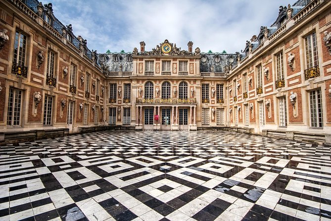 Versailles Domain Small-Group Guided Tour from Paris - Arriving beneath Louis XIV’s statue